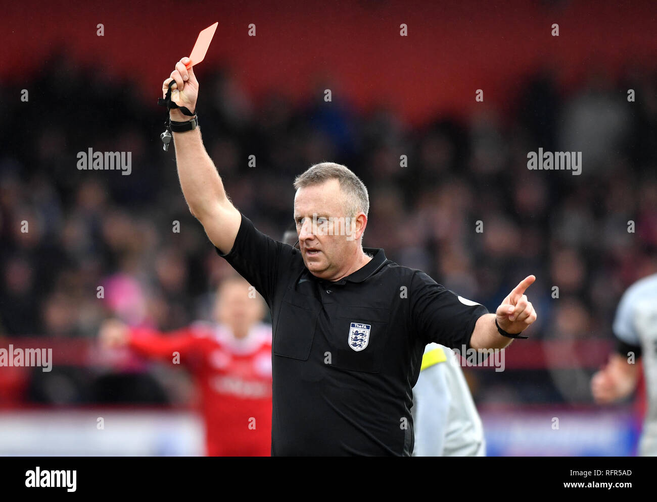 Referee Jon Moss shows Derby County's Jayden Bogle (not pictured) a red  card during the FA Cup fourth round match at the Wham Stadium, Accrington  Stock Photo - Alamy