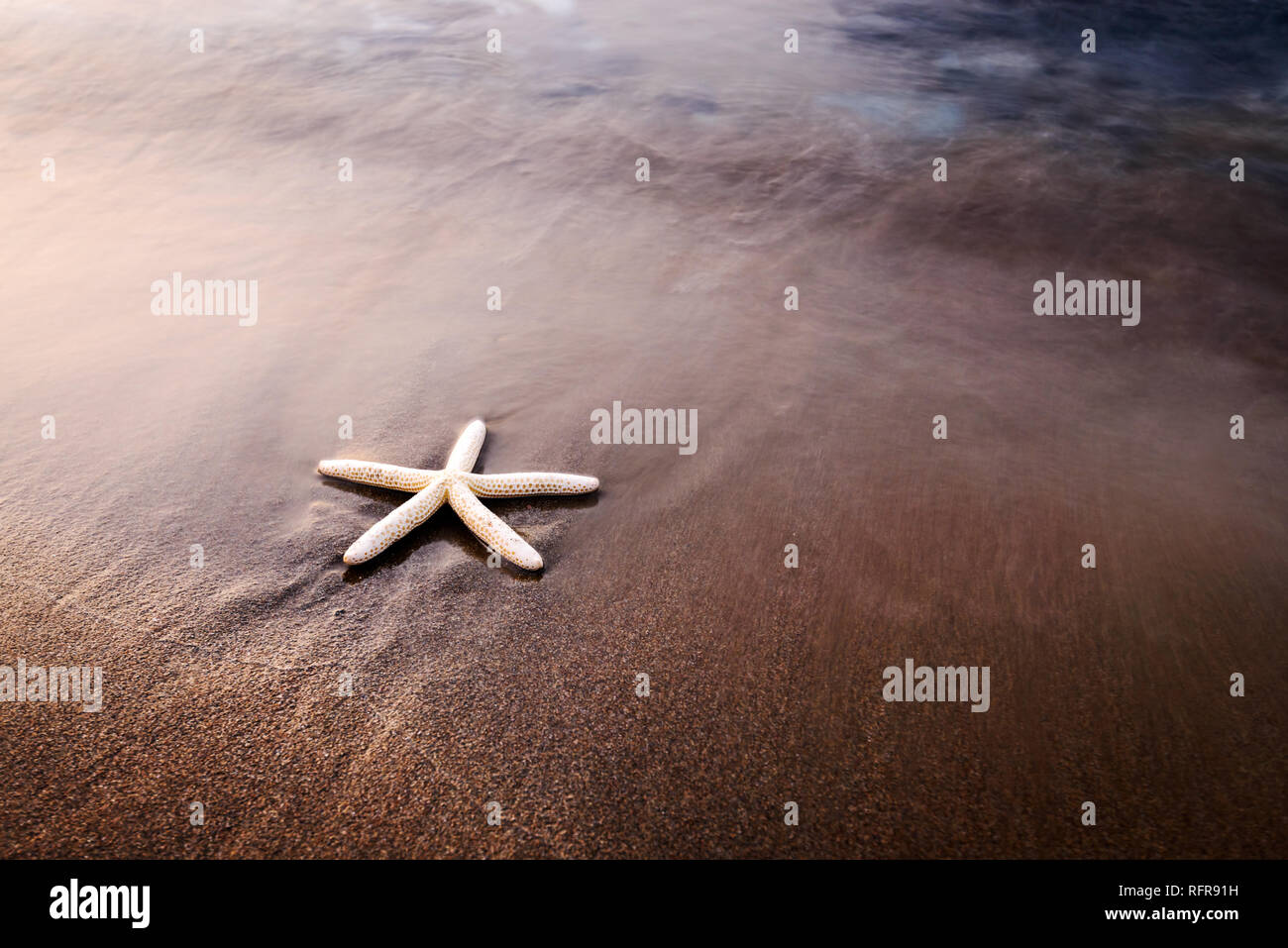 Amazing Mediterranean seascape with golden sand and blue waves. Summer vacations background Stock Photo