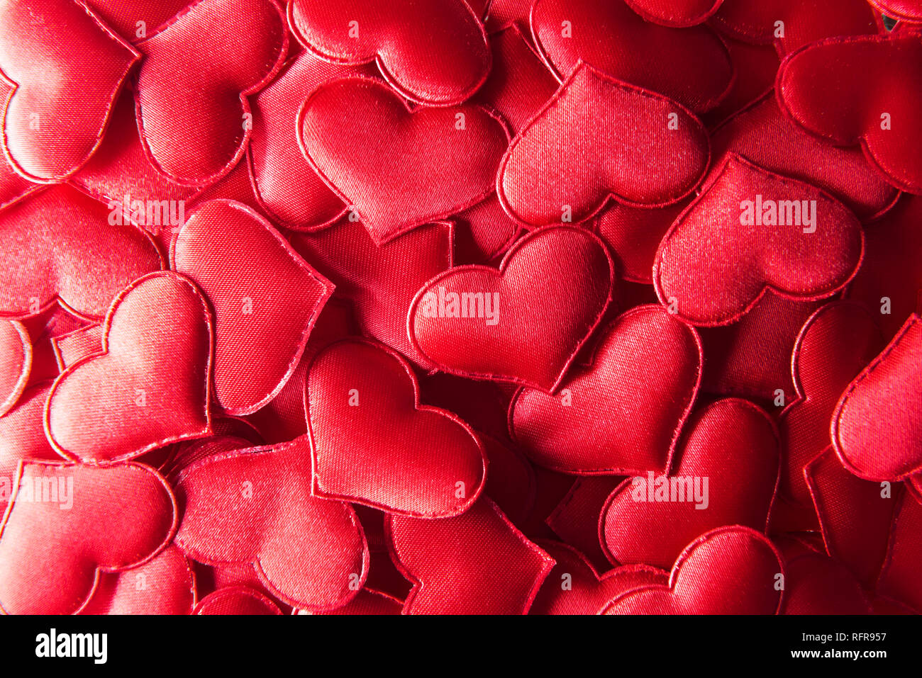 Red textile hearts closeup. Valentines day background, creative texture and love concept Stock Photo