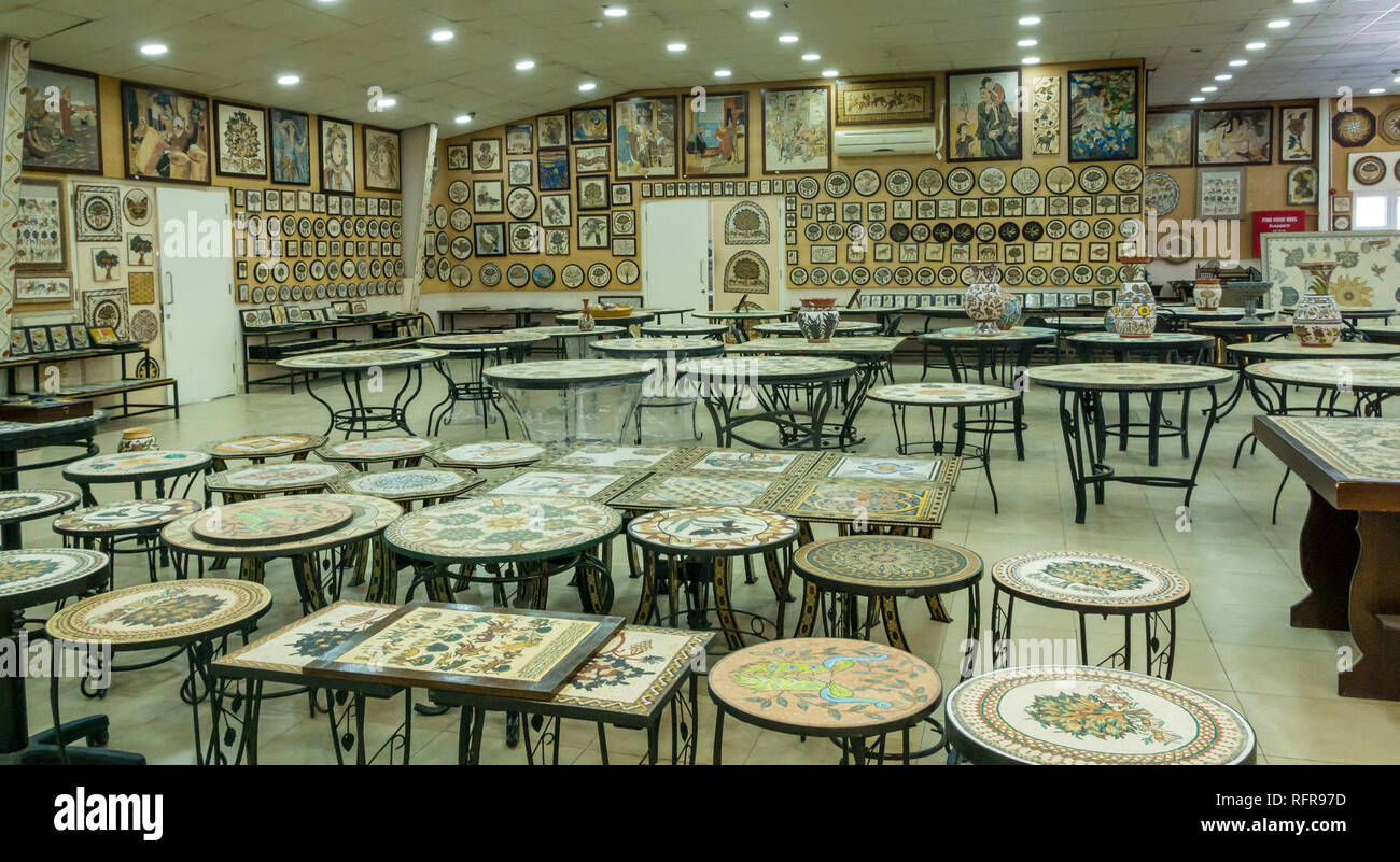 Interior of Madaba Art and Handicraft Centre with mosaic wall hangings and tables in shop display, Jordan, Middle East Stock Photo