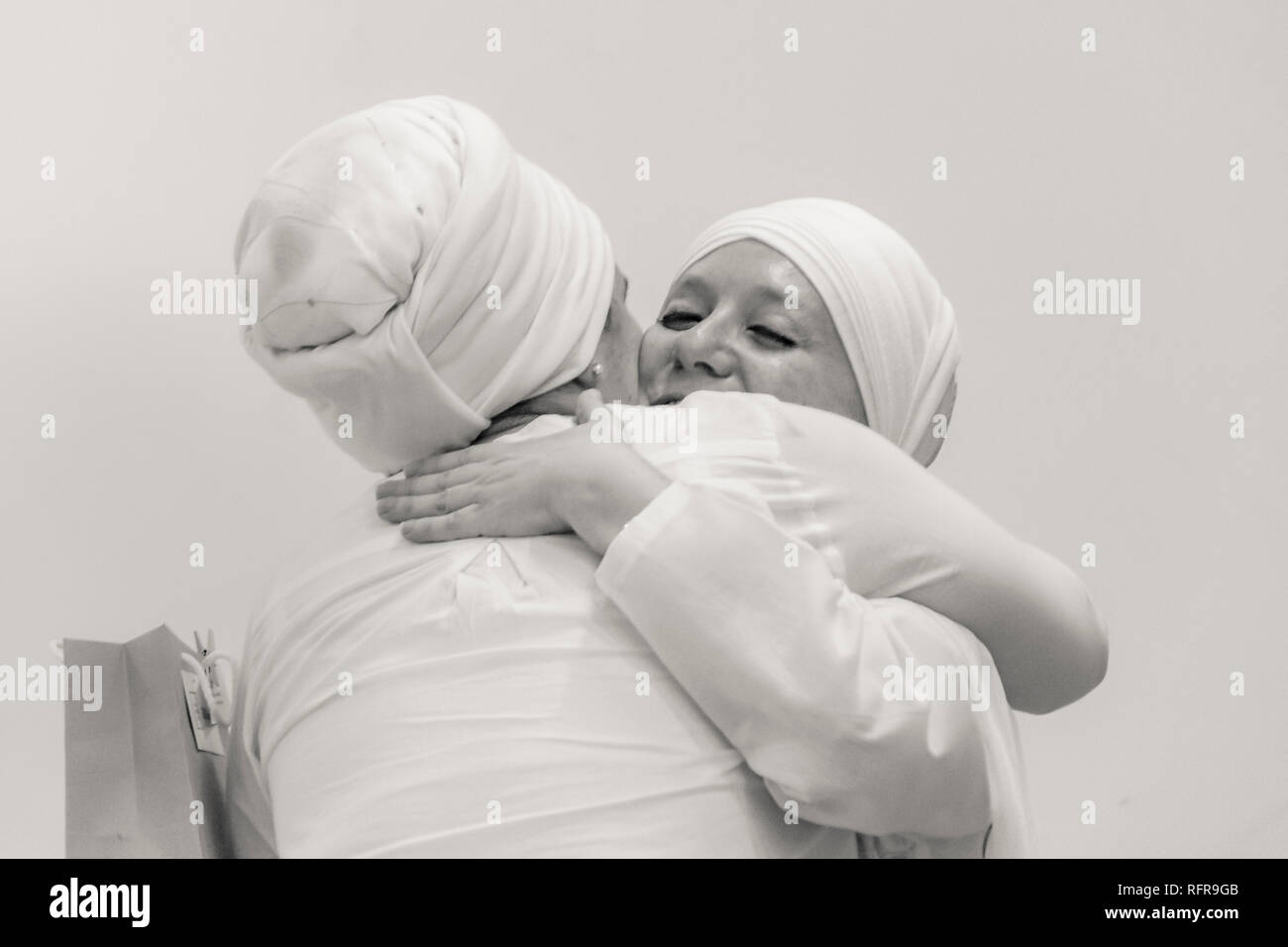 MONTEVIDEO, URUGUAY, OCTOBER - 2018 - Two adult yoga women hugging at the end of course Stock Photo