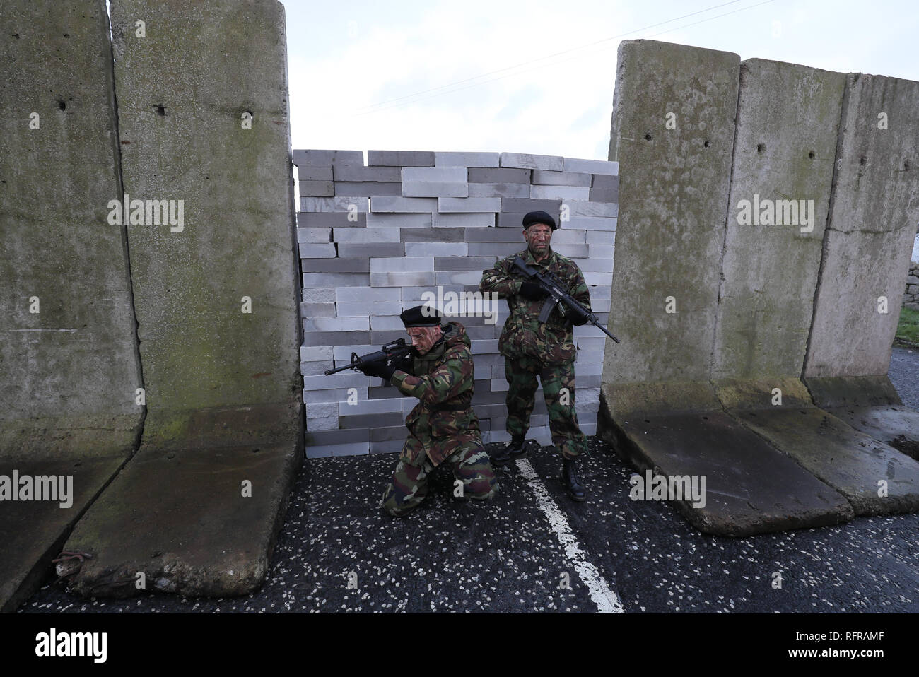 Actors in military fatigues take part in an anti-Brexit rally at the Irish border near Carrickcarnan, Co Louth, expressing their opposition to the imposition of a hard border between the Republic of Ireland and Northern Ireland. Stock Photo
