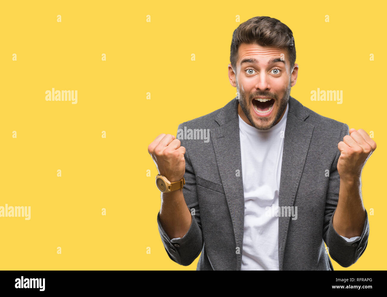 Young handsome business man over isolated background celebrating ...
