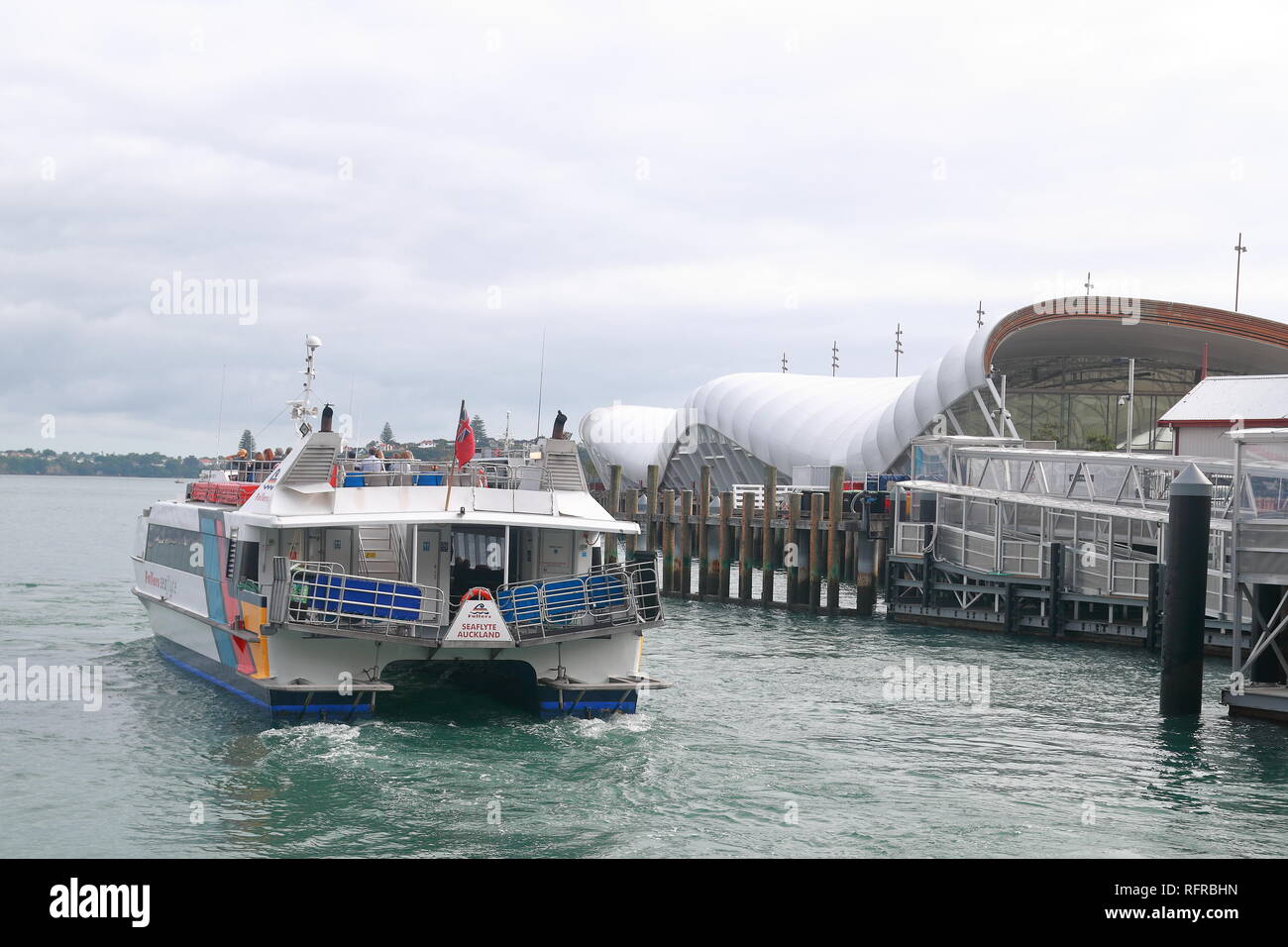 Ferry leaving Downtown Ferry Terminal in Auckland, New Zealand Stock Photo