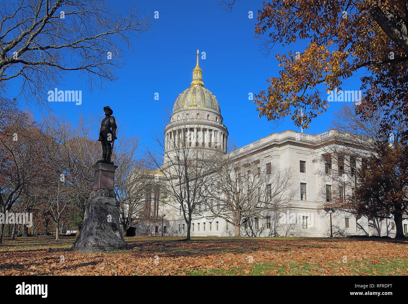 Historical statue and dome of the West Virginia capitol building in Charleston against a blight blue autumn sky Stock Photo