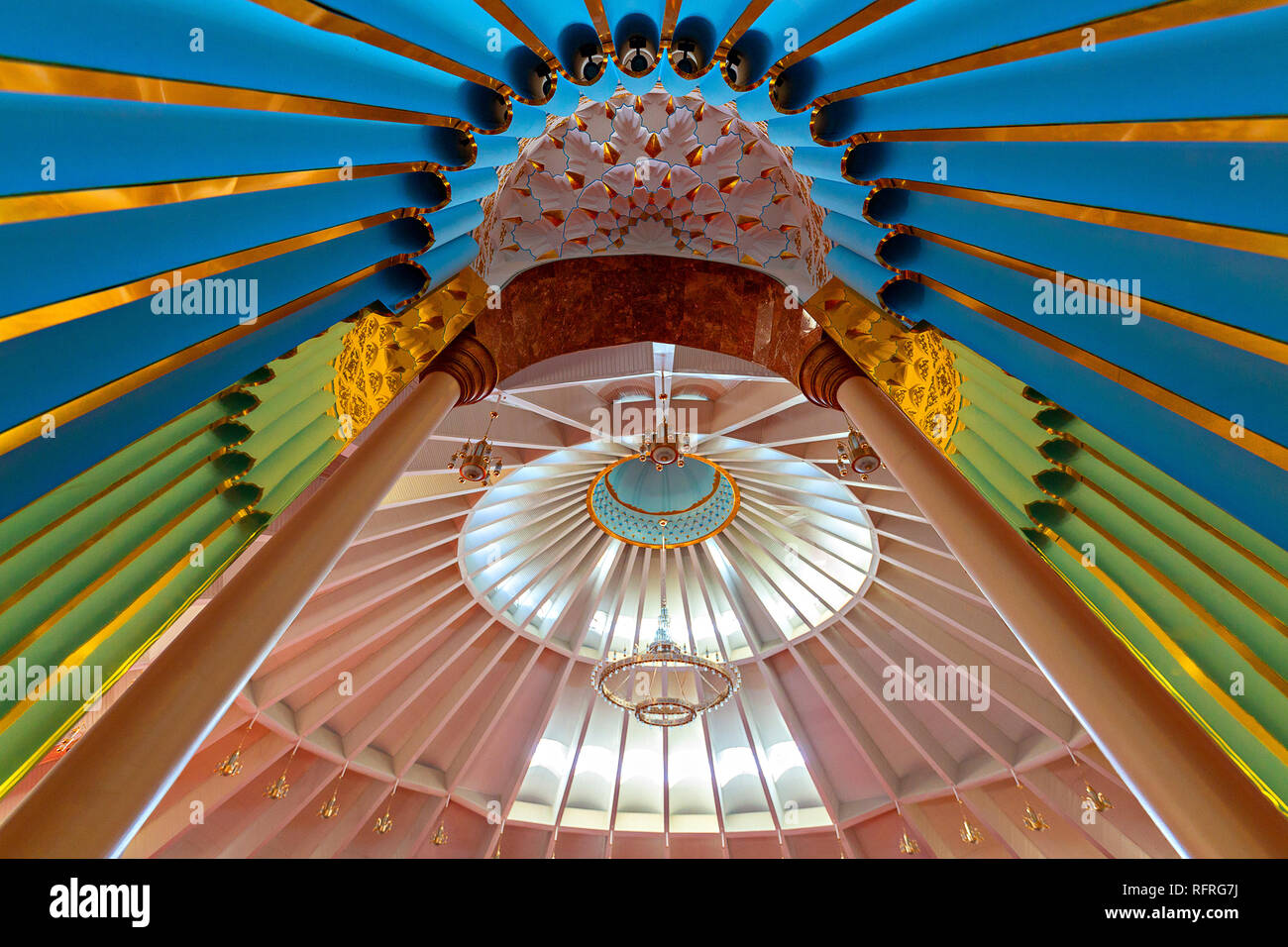 View over the interior of the Sheikh Khalifa Mosque through the decorated niche,  in Shymkent, Kazakhstan Stock Photo