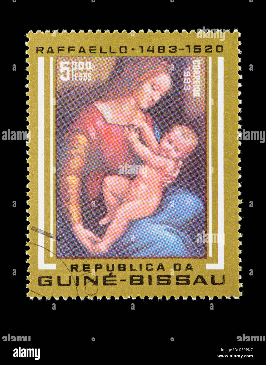 Postage stamp from Guinea-Bissau depicting a Raphael painting of a woman with a child, 500th anniversary of birth Stock Photo