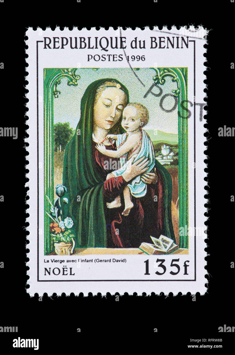 Postage stamp from Benin depicting painting detail from 'The Virgin and the Infant' by Gerard David. Stock Photo