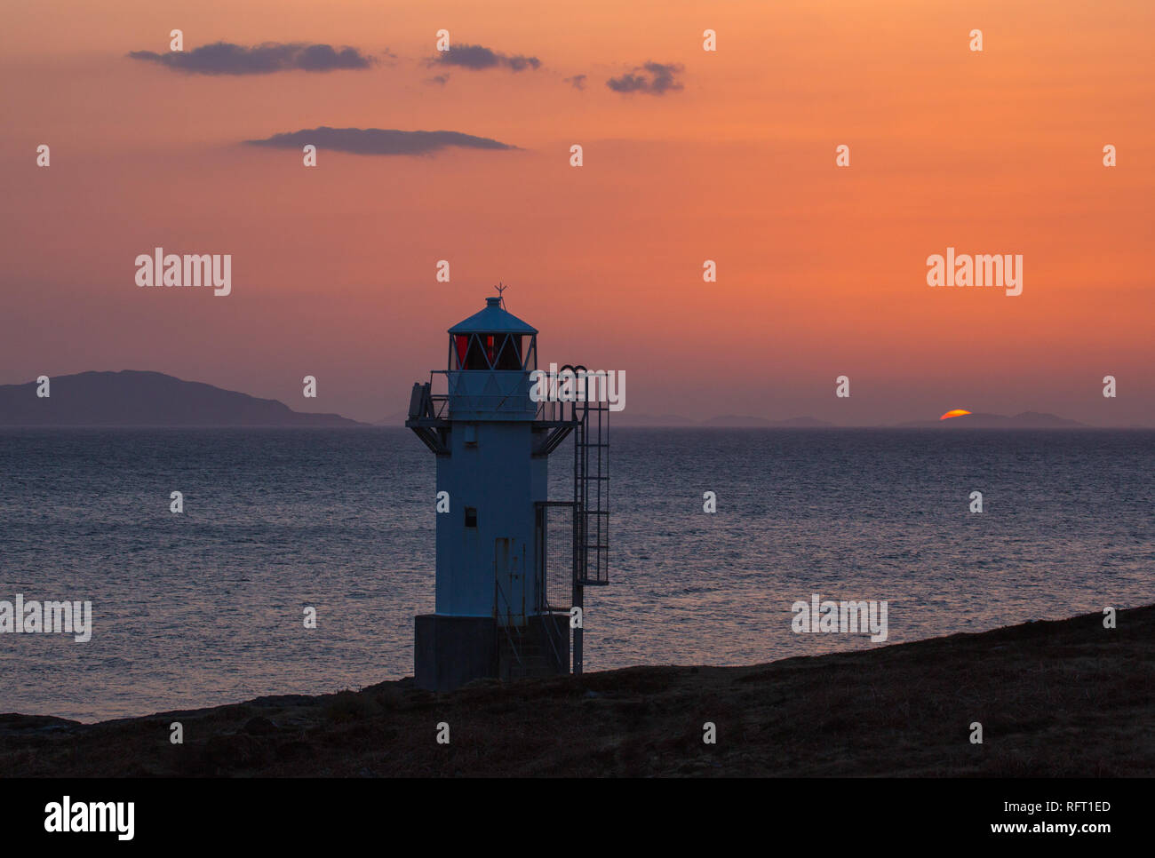Rubha Cadail Lighthouse, Rhue, Ullapool at sunset Stock Photo