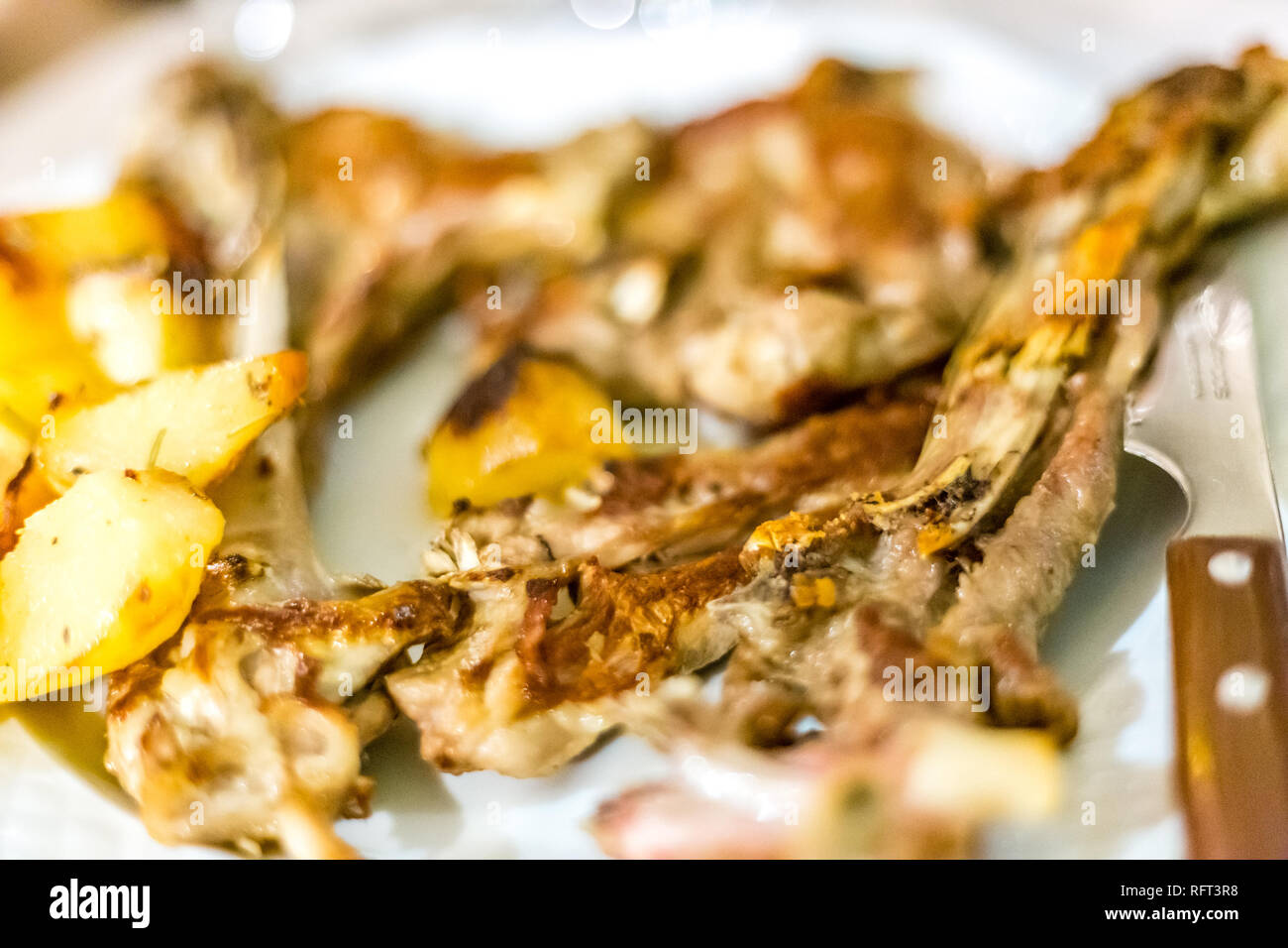Lamb chops with potatoes in Italian restaurant Stock Photo - Alamy