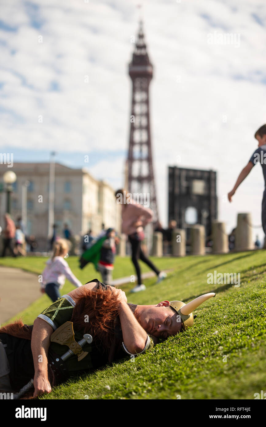 Hungover man dressed as Viking sleeps in Blackpool Stock Photo