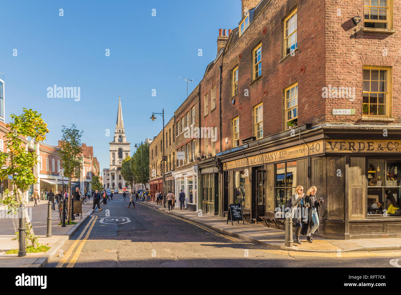 Beautiful old shops on Brushfield Street, with Christ Church in the background, in Spitalfields, London, England, United Kingdom, Europe Stock Photo