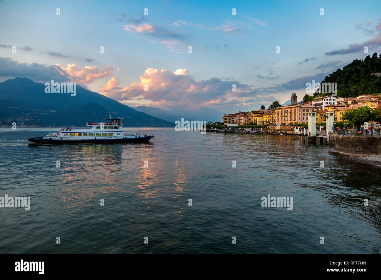 View of Lake Como and ferry arriving at Bellagio at sunset, Province of Como, Lake Como, Lombardy, Italian Lakes, Italy, Europe Stock Photo
