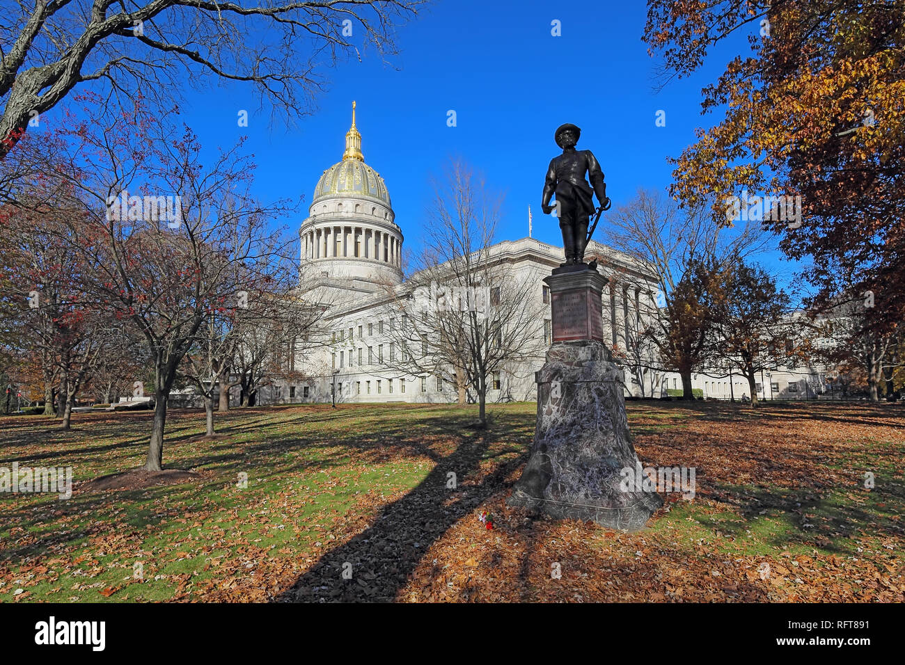 Historical statue and dome of the West Virginia capitol building in Charleston against a blight blue autumn sky Stock Photo