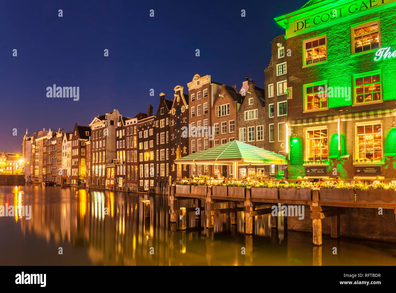 The Grasshopper steakhouse on Oudebrugsteeg Damrak canal with typical dutch houses, central Amsterdam, North Holland, Netherlands, Europe Stock Photo