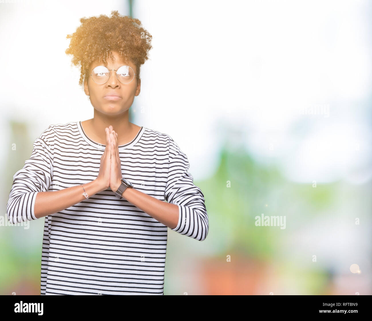 Hope Expression Beautiful young african american woman wearing glasses over isolated ...