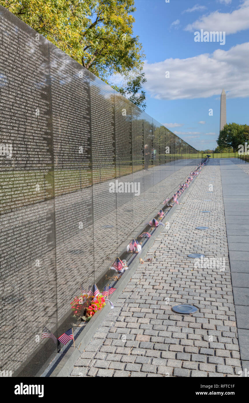 The Wall, Washington Monument in the background, Vietnam Veterans Memorial, Washington D.C., United States of America, North America Stock Photo