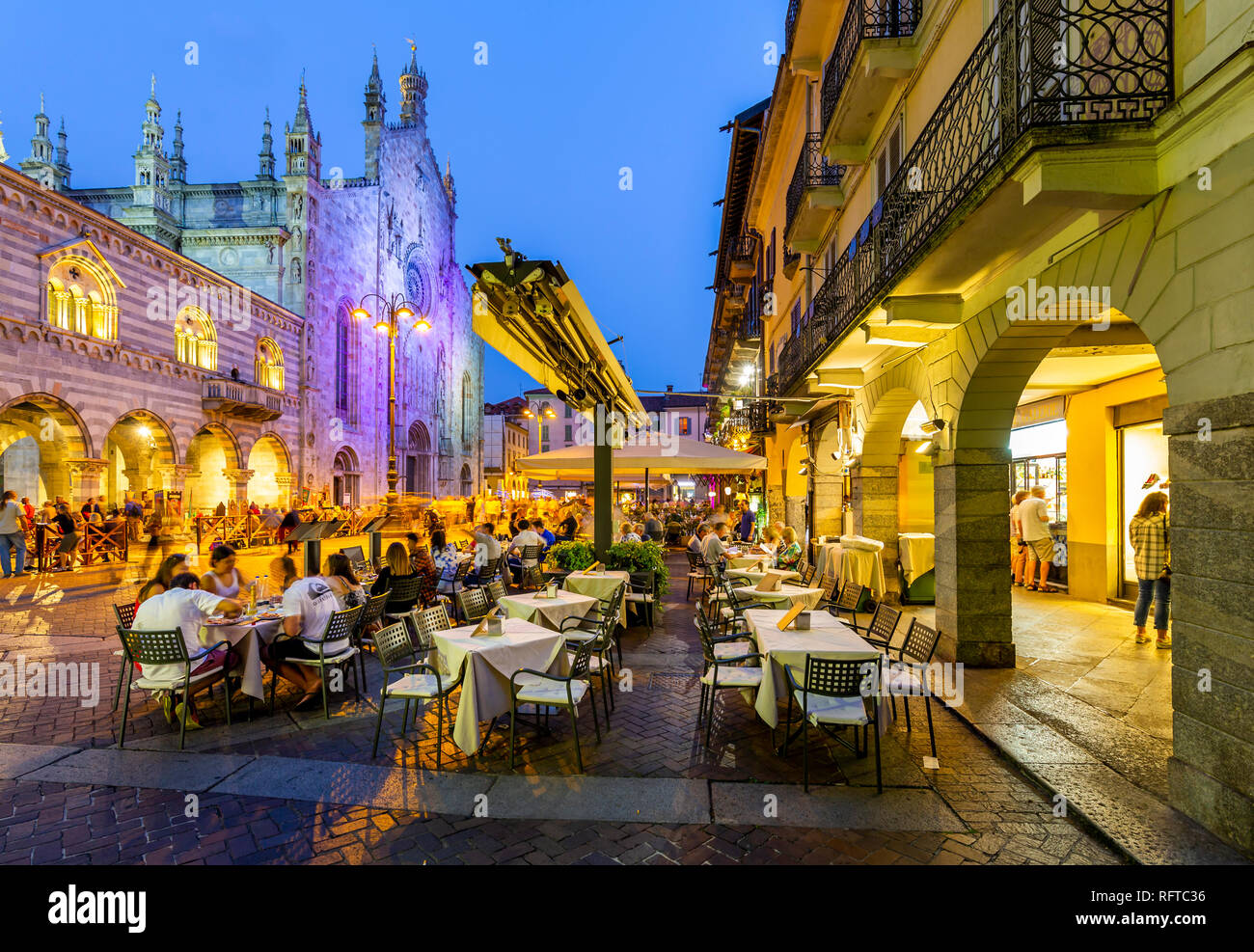 View of Duomo and restaurants in Piazza del Duomo at dusk, Como, Province of Como, Lake Como, Lombardy, Italy, Europe Stock Photo