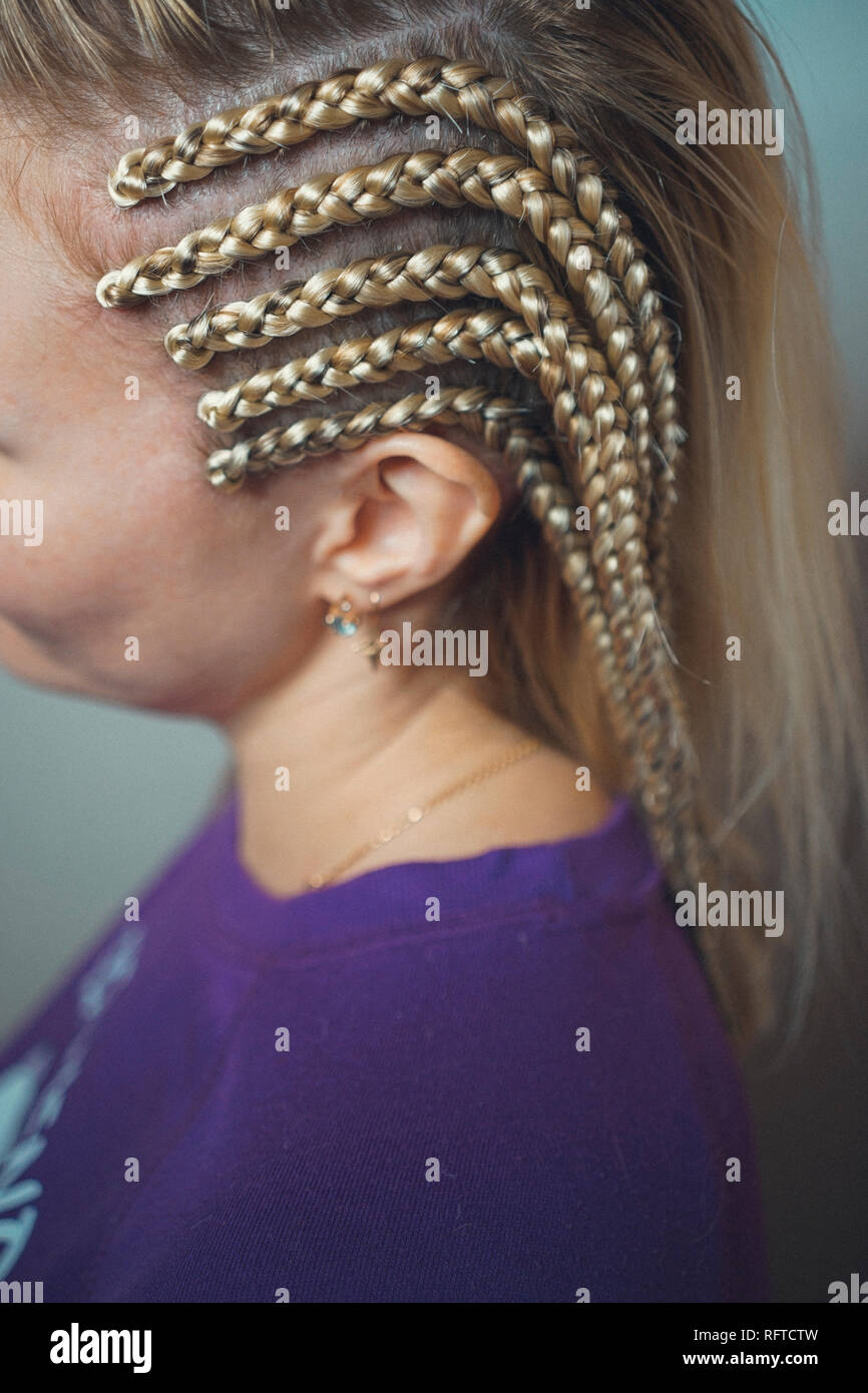 cornrows Brades on the temple for the girl blondes Stock Photo