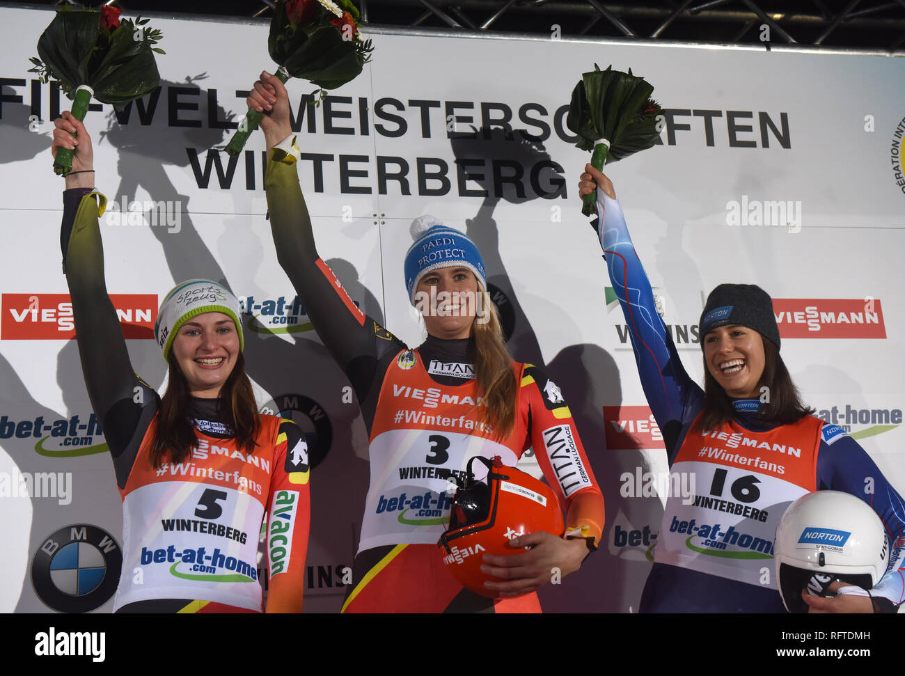 Winterberg, Germany. 26th Jan, 2019. Single-seater, ladies, artificially-iced track in Winterberg: The luge athletes Julia Taubitz (l-r), Natalie Geisenberger from Germany and Emily Sweeney from the USA cheer for their placings. Credit: Caroline Seidel/dpa/Alamy Live News Stock Photo