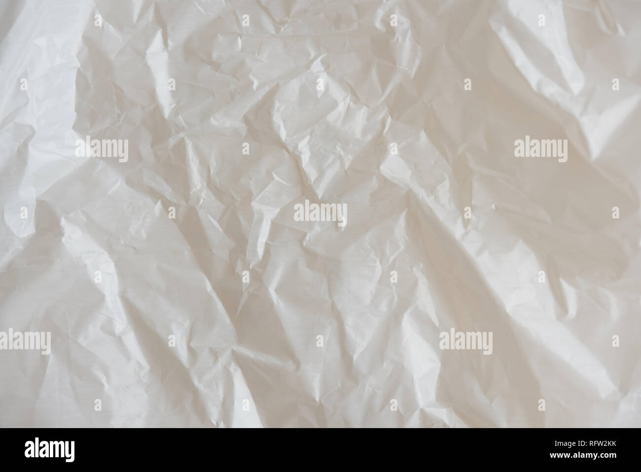 Crumpled white plastic texture close up view Stock Photo