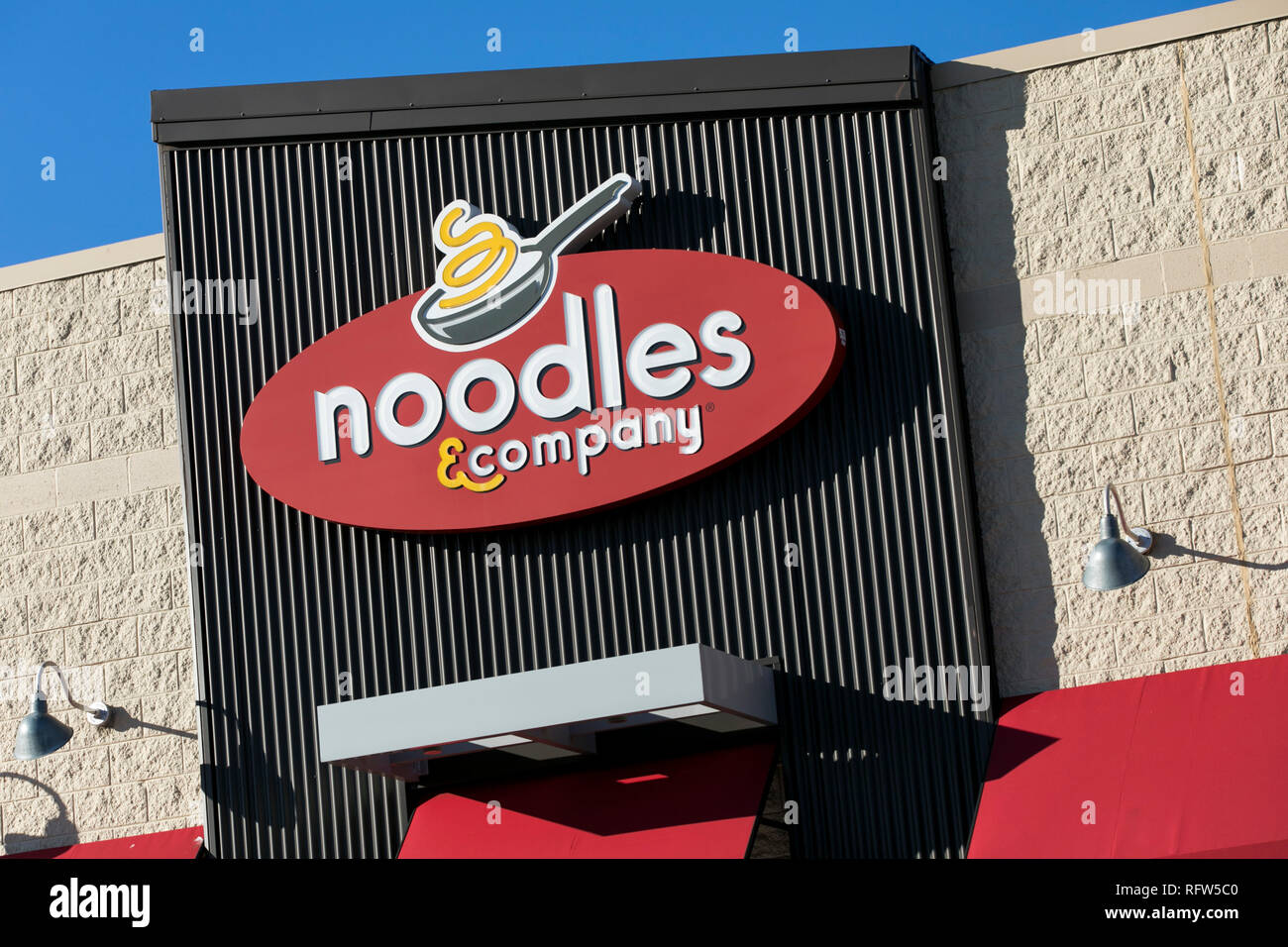 A logo sign outside of a Noodles & Company restaurant location in Woodbridge, Virginia, on