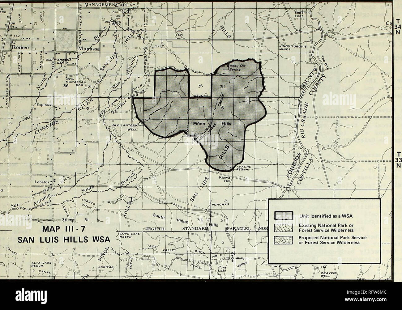 . Canon City District wilderness planning amendment. Wilderness areas; Land use. 46 CO-050-141 R 9 E N R 10E RUE MAP III-7 SAN LUIS HILLS WSA X ;. iREsvft S&gt;4fffr&gt;. !^ Mili-s SAN LUIS HILLS (141) This unit contains 10,240 acres of land located approximately 3 miles southeast of Manassa. The WSA lies within T. 33 N.. R. 10 and 11 E., T. 34 N., R. 10 and 11 E., NMPM. (See Map III-7.) Air This unit is considered Class II by Federal Air Quality Standards* Geology and Minerals This unit is located at the confluence of two major structural trends. Ore deposits are commonly localized at such tr Stock Photo