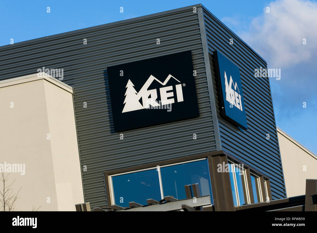A logo sign outside of a REI (Recreational Equipment, Inc.) retail