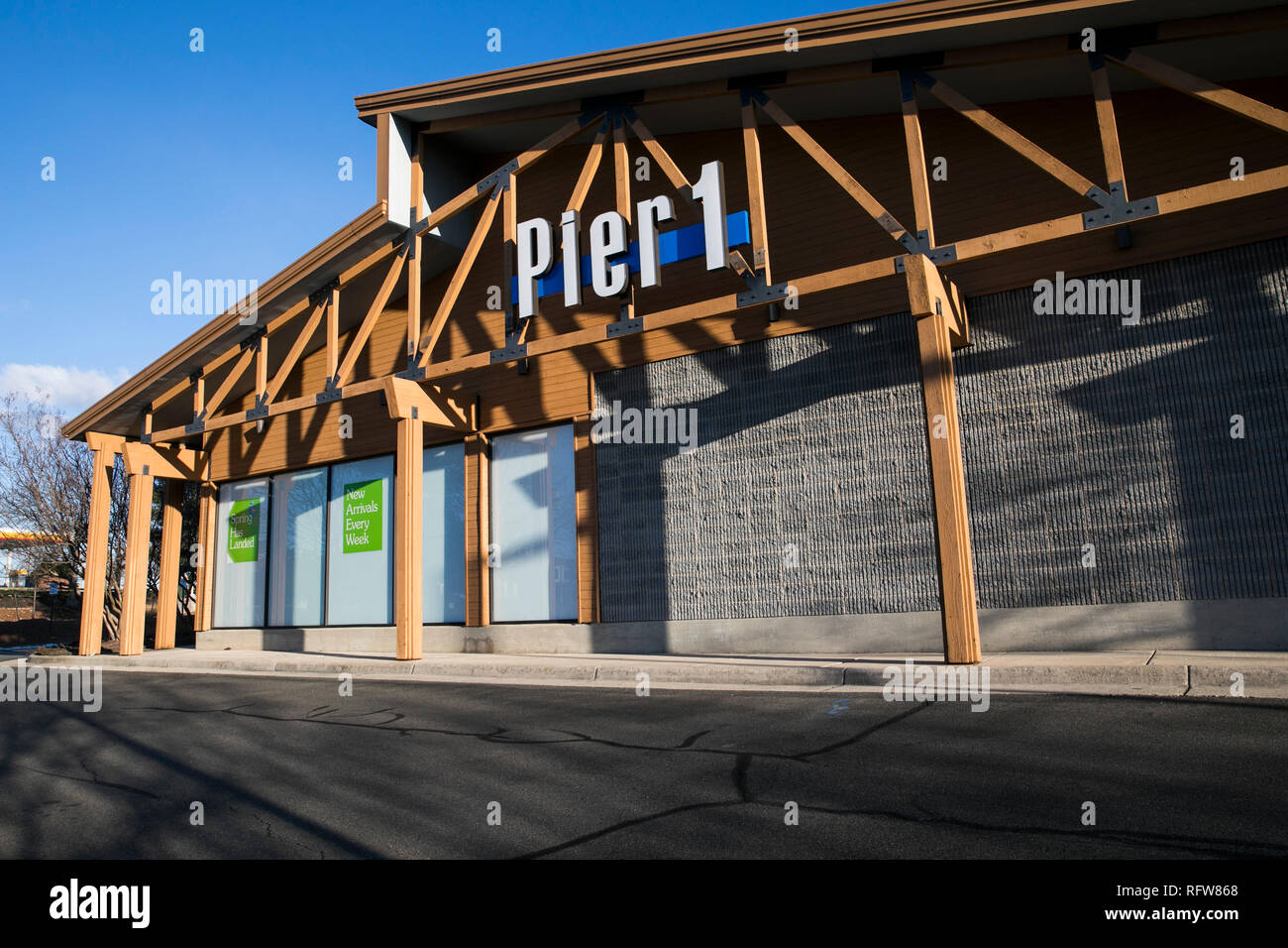 A logo sign outside of a Pier 1 Imports Inc., retail store in