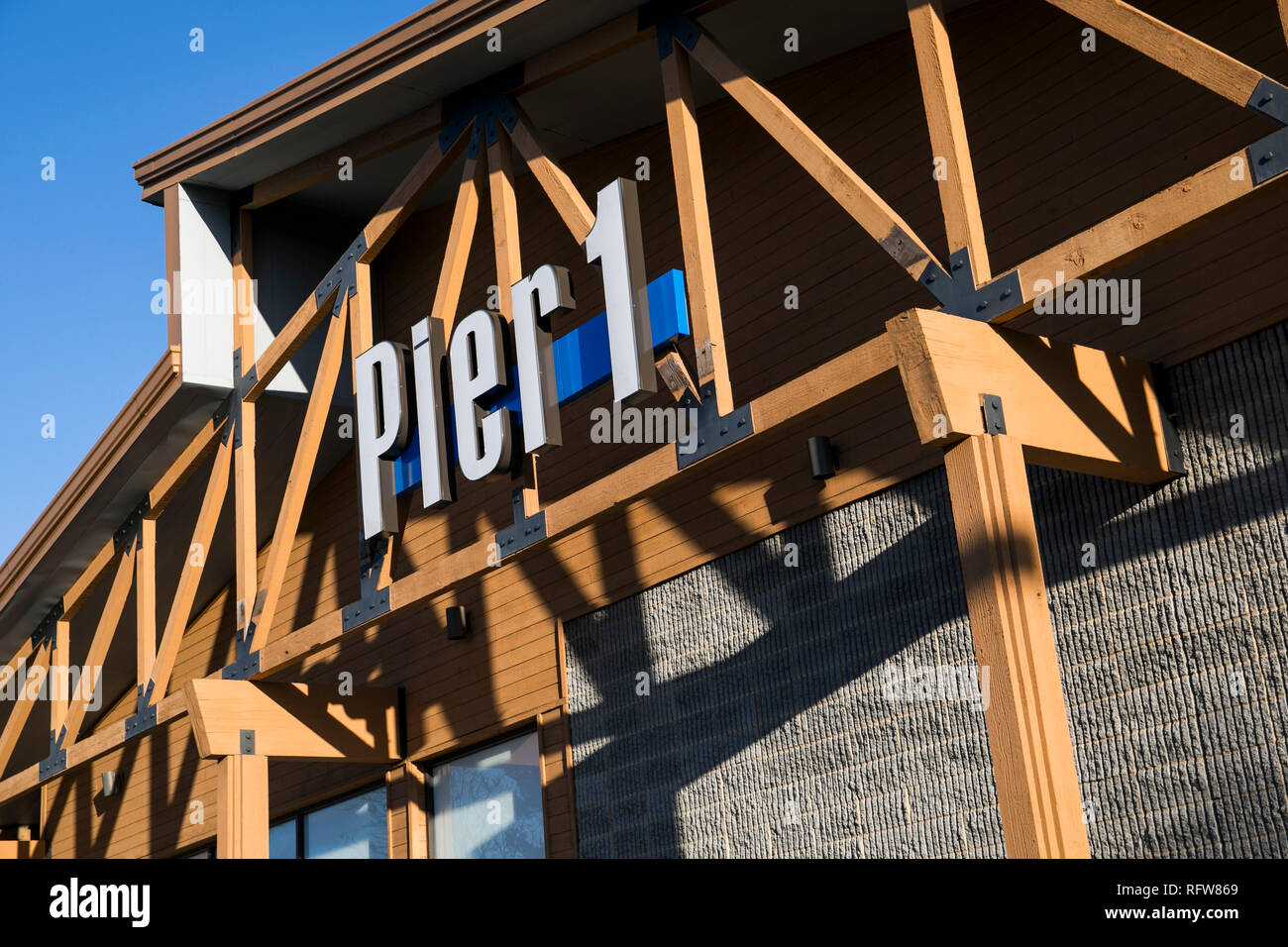 A logo sign outside of a Pier 1 Imports Inc., retail store in