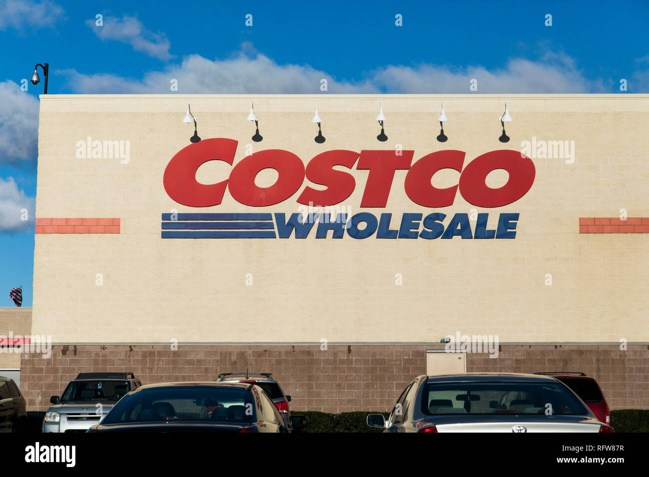 A logo sign outside of a Costco Wholesale warehouse store in Woodbridge