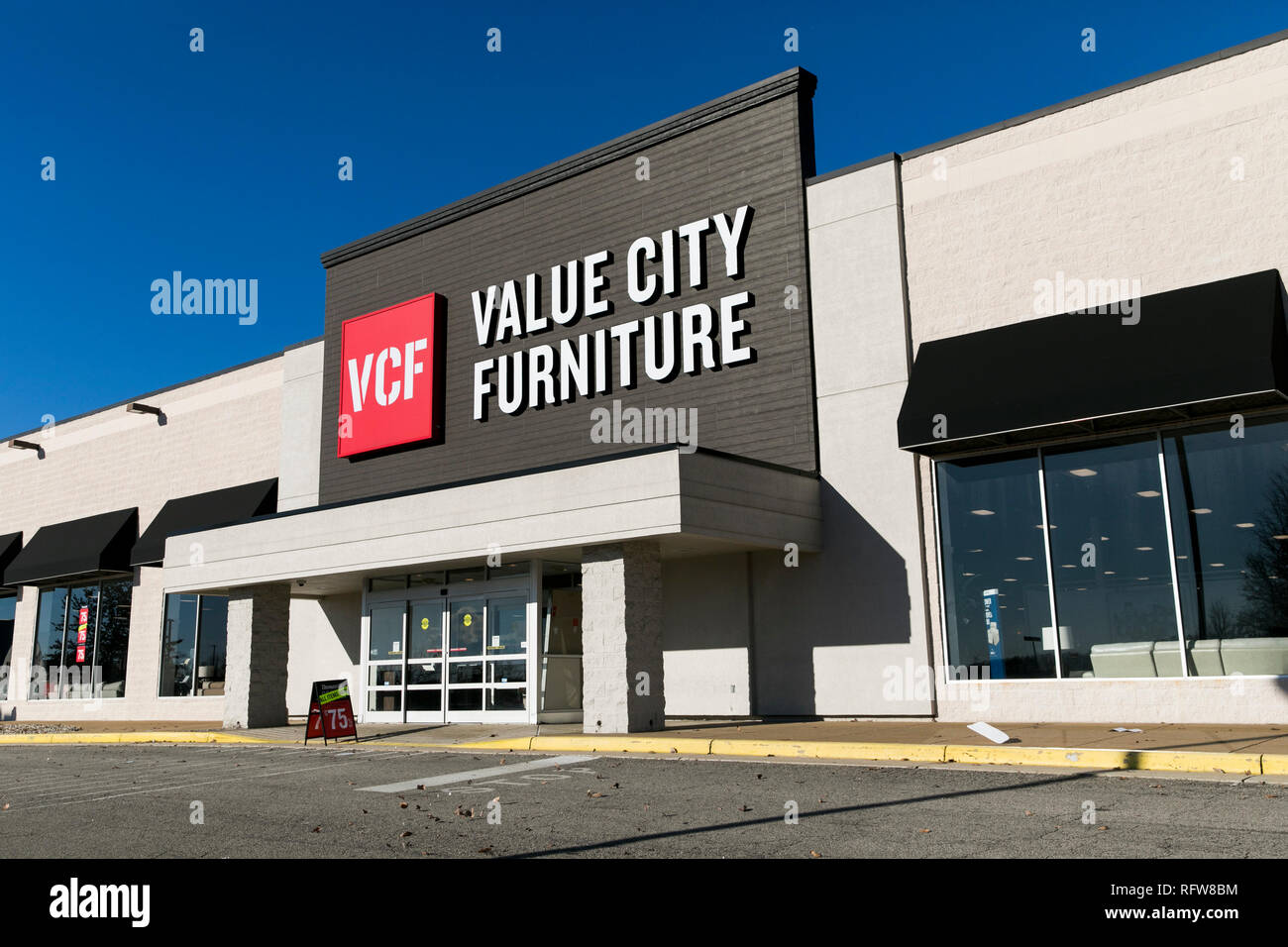 A Logo Sign Outside Of A Value City Furniture Retail Store