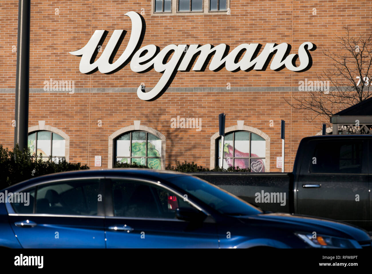 A logo sign outside of a Wegmans Food Markets grocery store in Frederick, Maryland, on January 22, 2019. Stock Photo