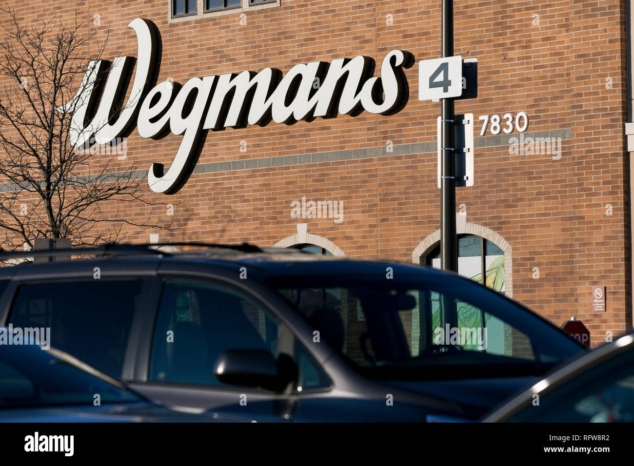 A logo sign outside of a Wegmans Food Markets grocery store in Frederick, Maryland, on January 22, 2019. Stock Photo