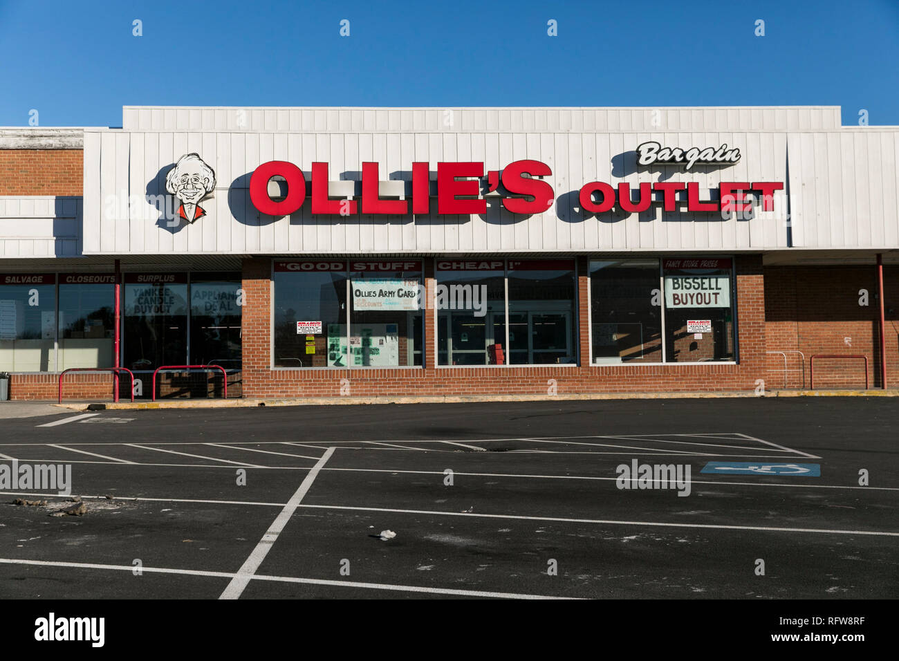 A logo sign outside of a Ollie's Bargain Outlet retail store in