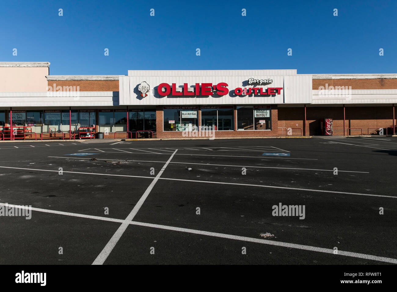 A logo sign outside of a Ollie's Bargain Outlet retail store in