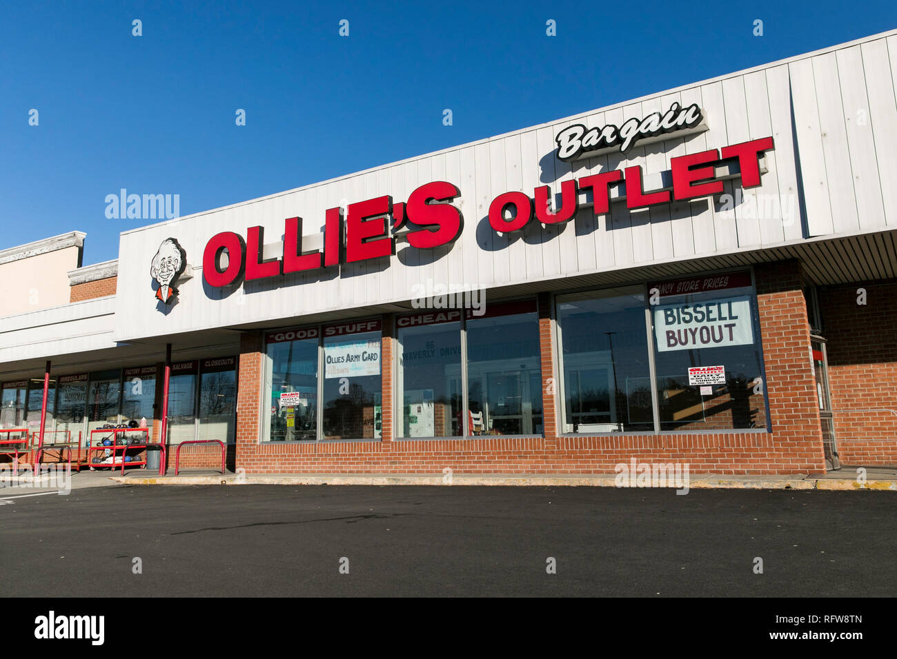 A logo sign outside of a Ollie's Bargain Outlet retail store in