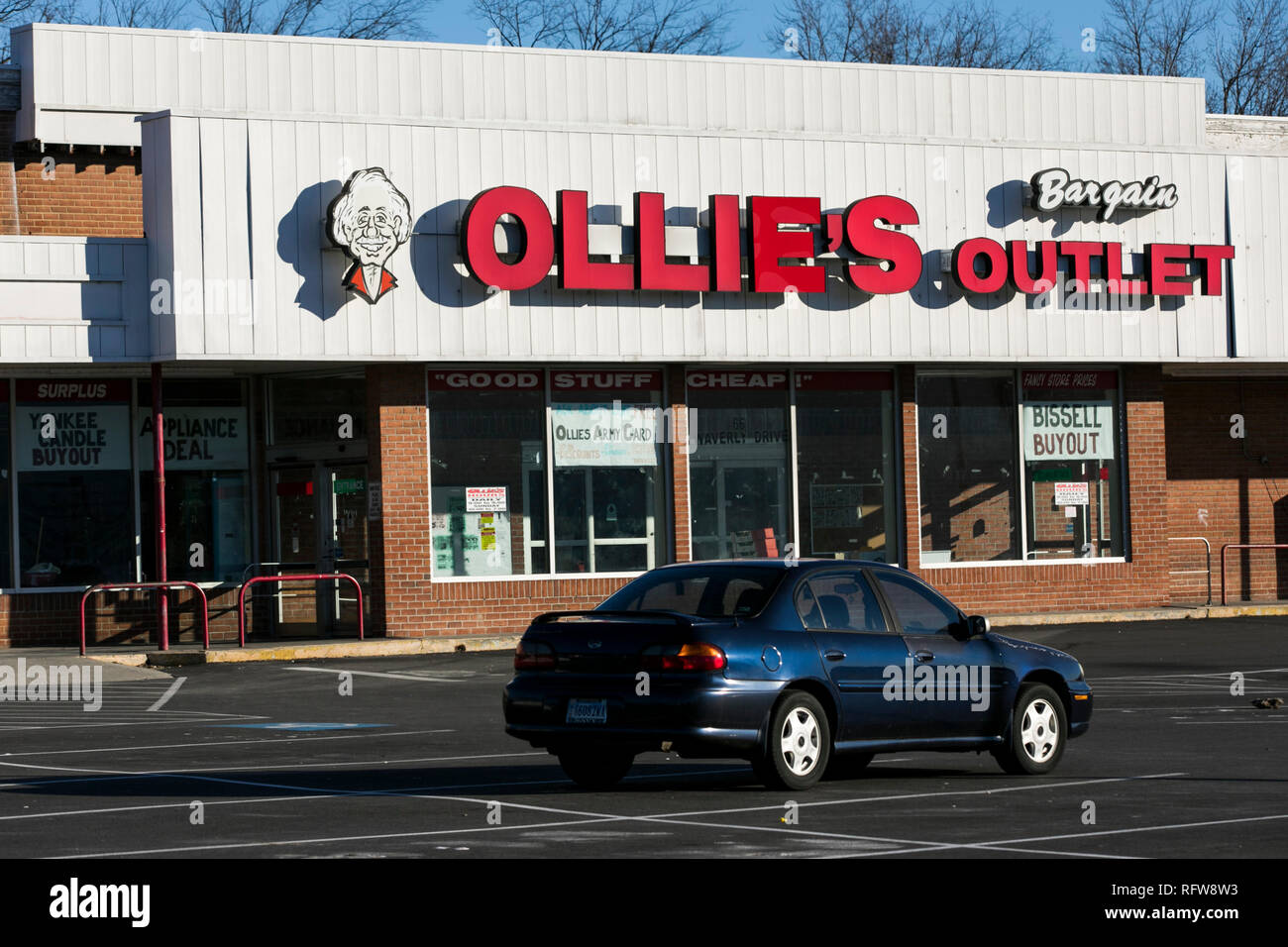 A logo sign outside of a Ollie's Bargain Outlet retail store in