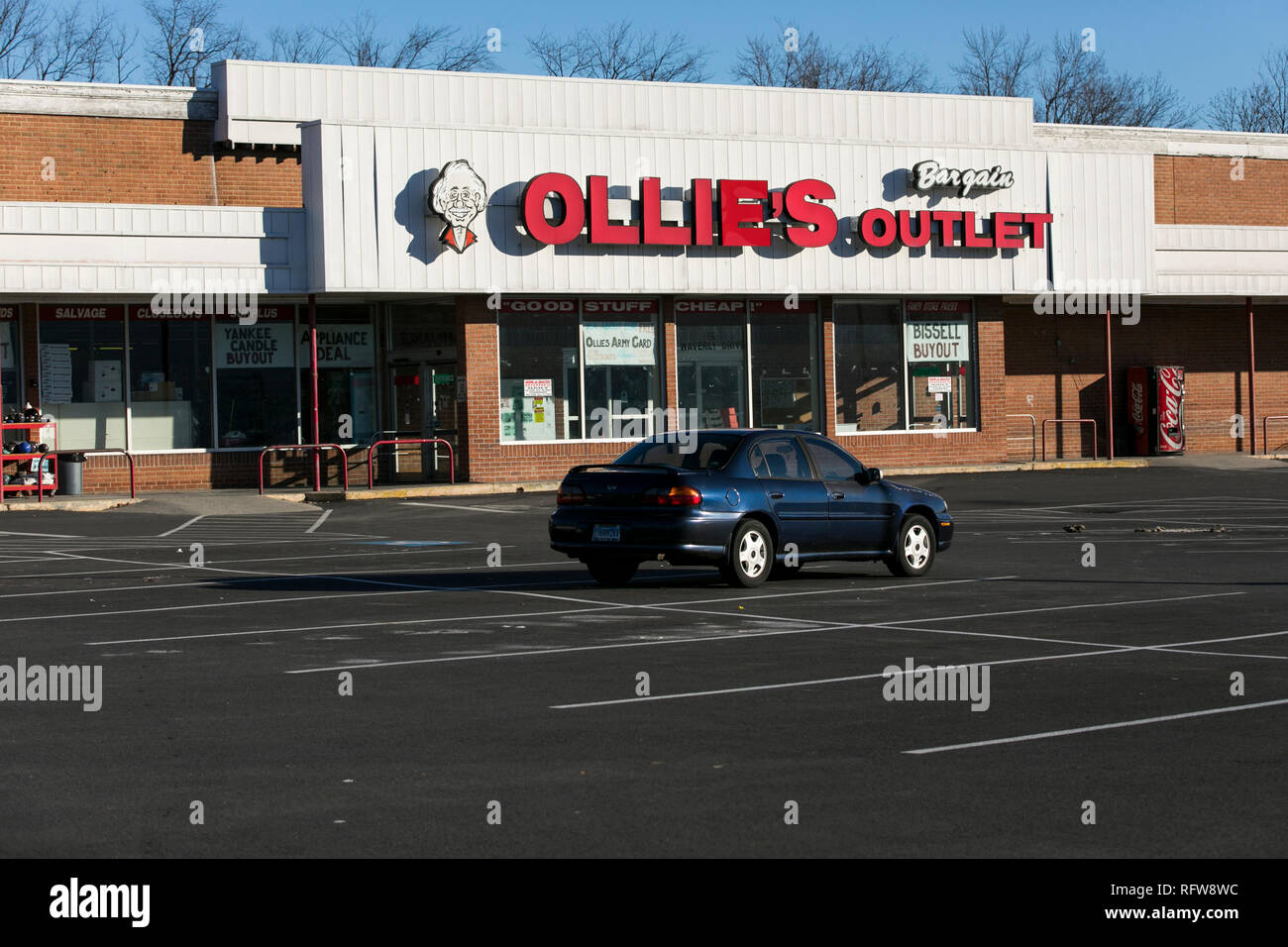 A logo sign outside of a Ollie's Bargain Outlet retail store in