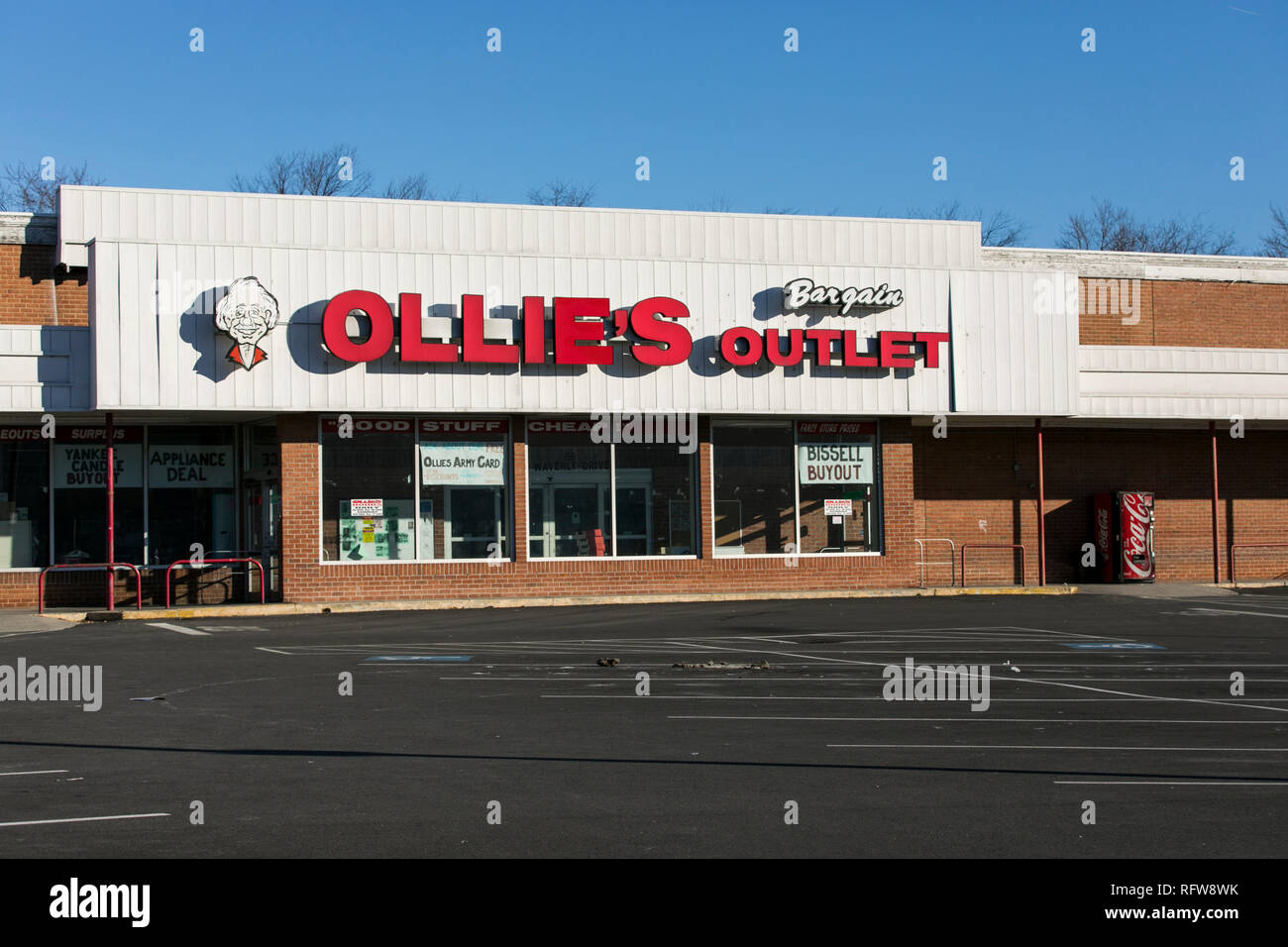 A logo sign outside of a Ollie's Bargain Outlet retail store in
