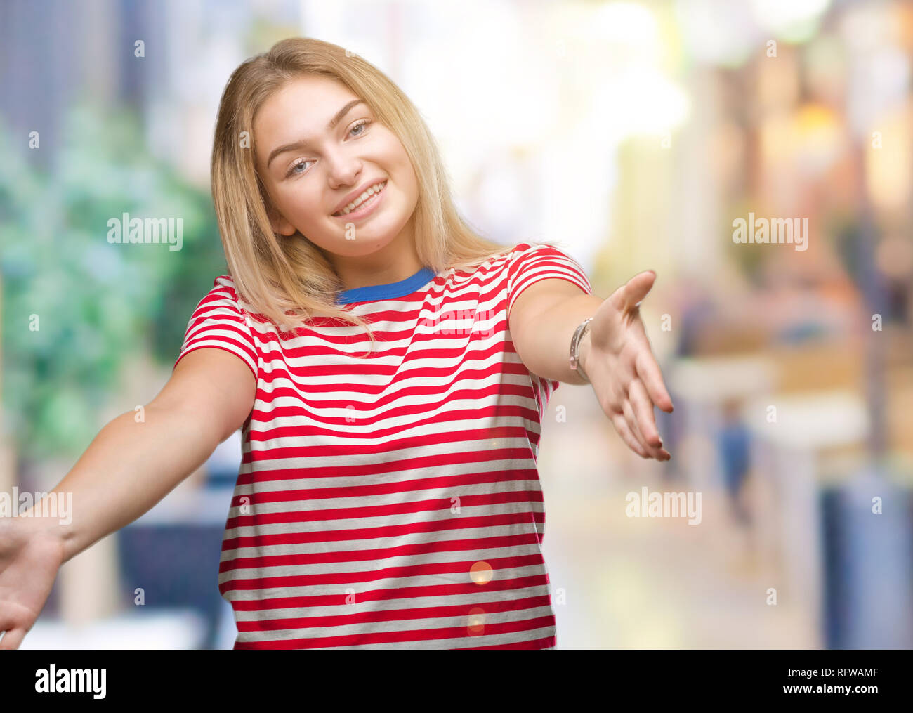 Young caucasian woman over isolated background looking at the camera ...