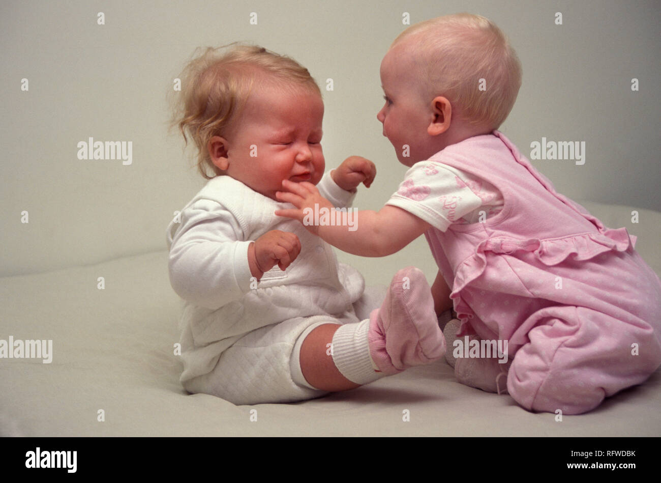 two babies fighting Stock Photo