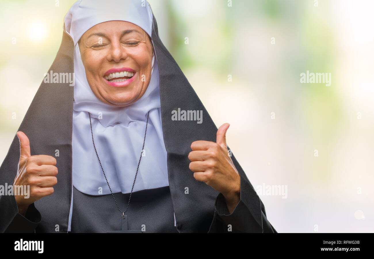 Middle Age Senior Christian Catholic Nun Woman Over Isolated Background Success Sign Doing