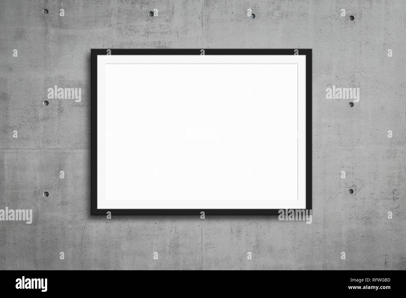 black picture frame hanging on grey concrete wall,  mockup Stock Photo