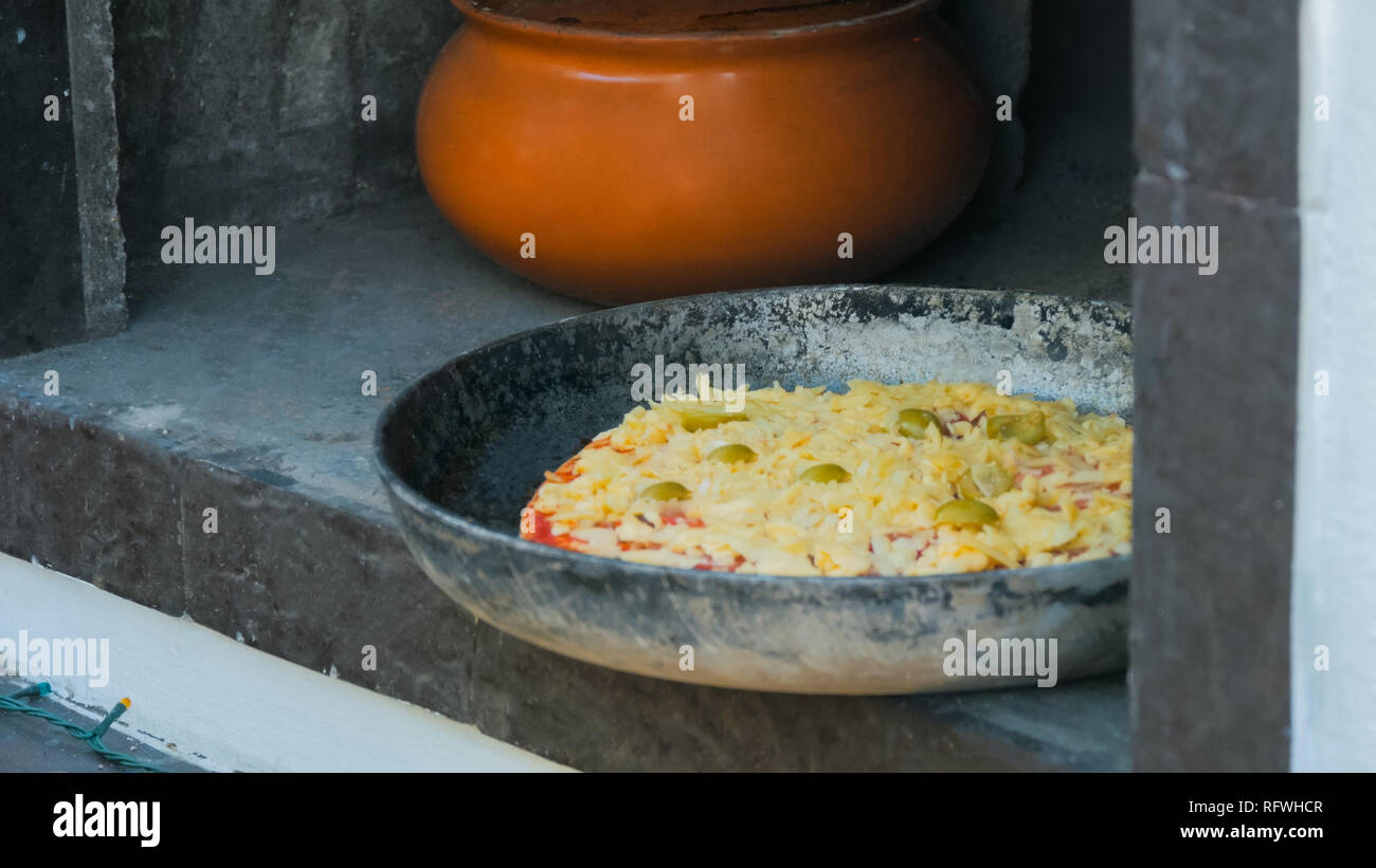 Process Of Cooking Hot Mini Pies With Chicken And Cheese At - 