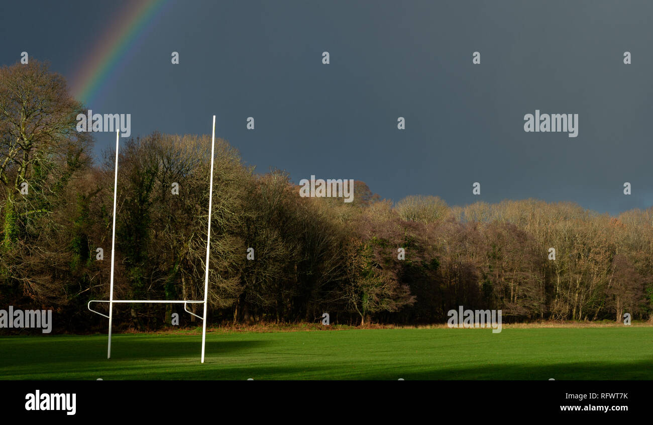 Gaelic Irish football training ground goal in dramatic light. Rainbow over countryside training pitch in Killarney, County Kerry, Ireland Stock Photo