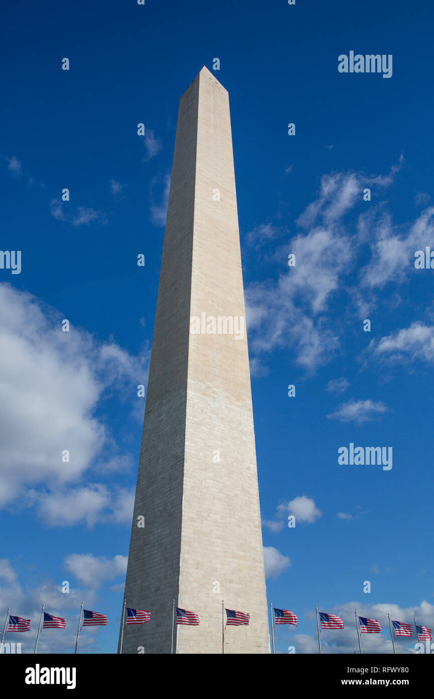 Washington Monument with American flags below, Washington D.C., United States of America, North America Stock Photo