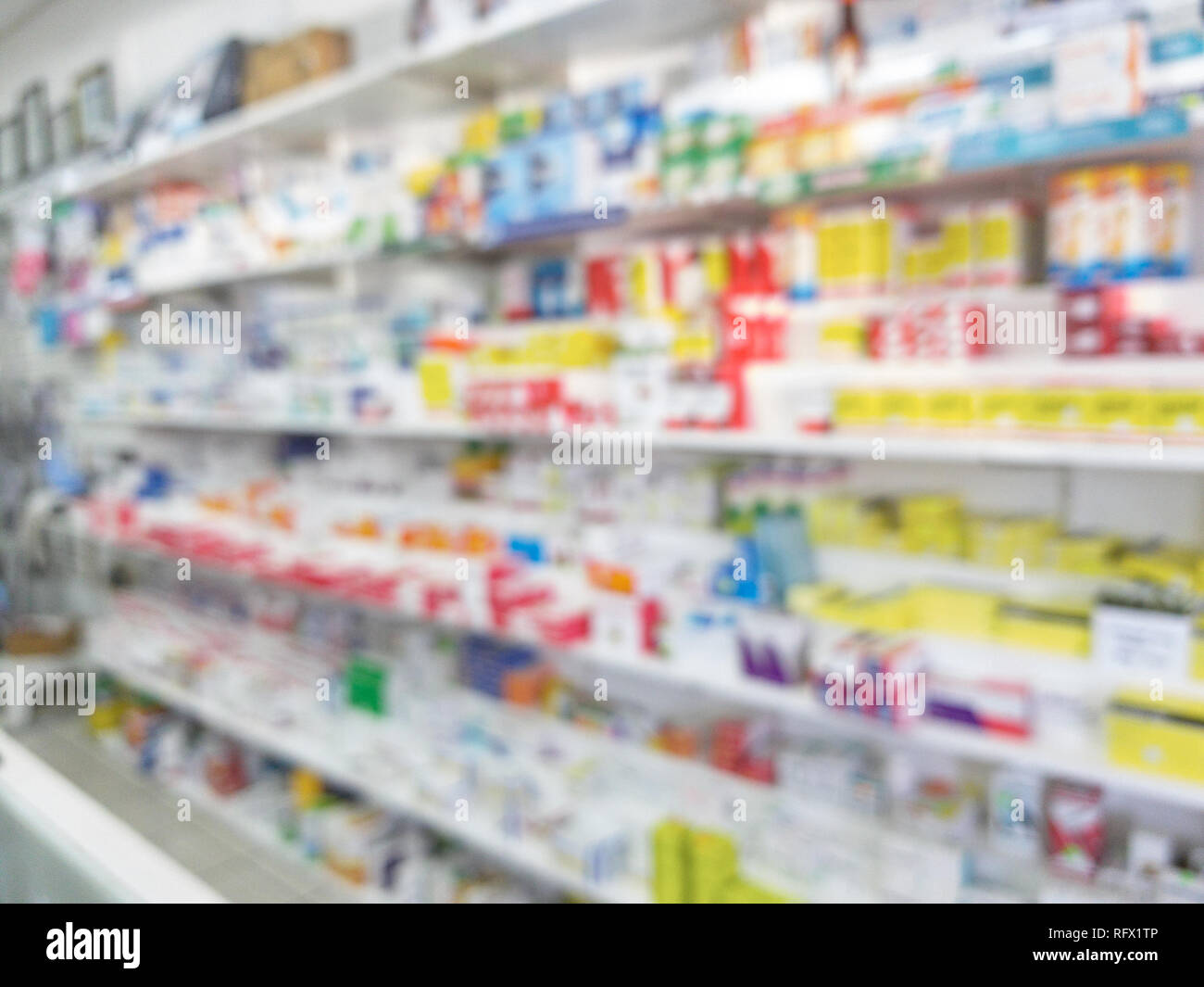 Shelf in pharmacy background. Defocused drugstore counter Stock Photo