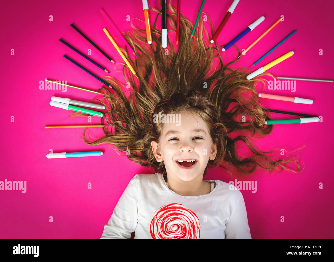 Little girl with color pencils Stock Photo