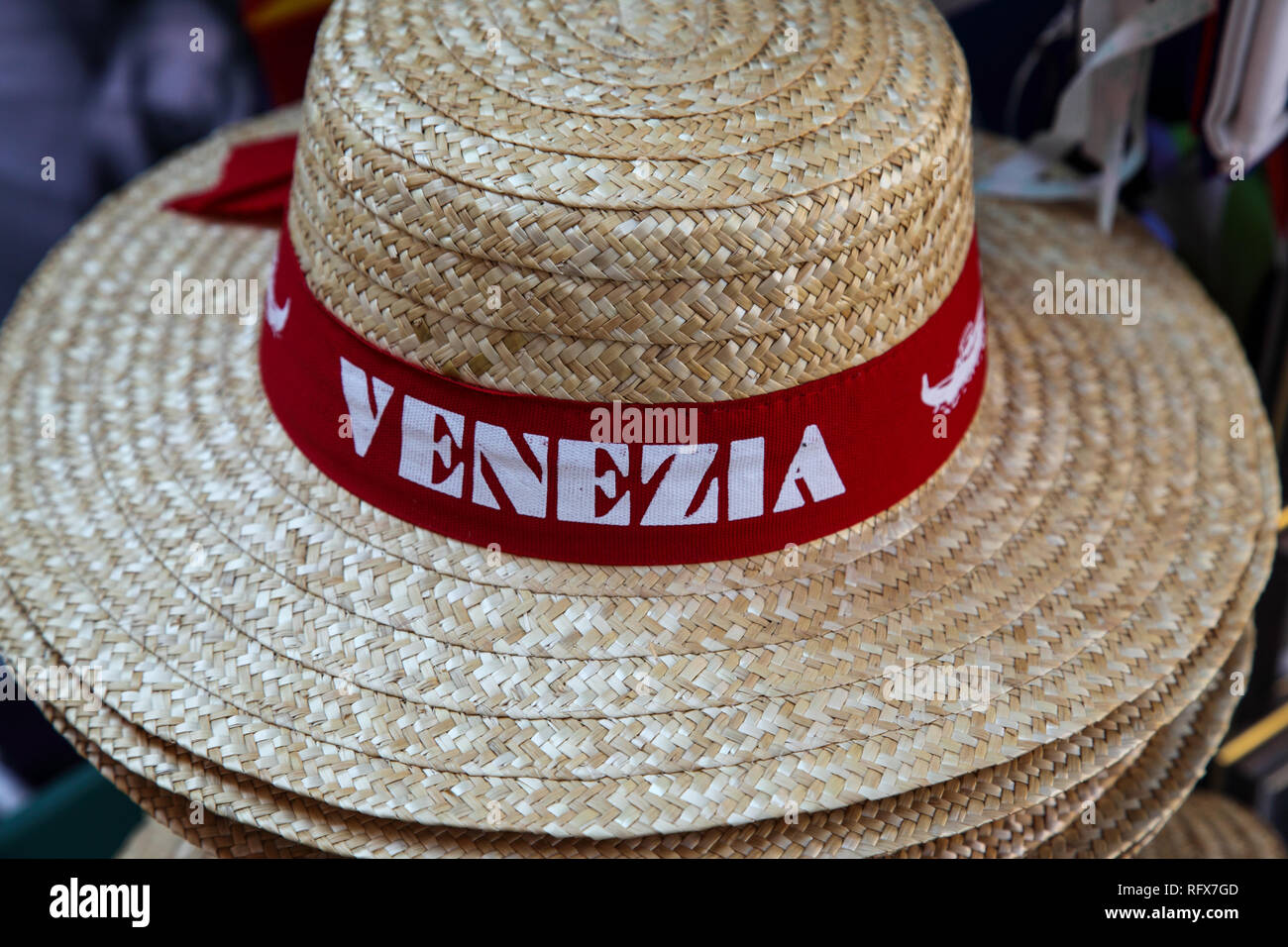 Straw hat emblazoned with 'Venezia' which are popular with tourists in Venice. Stock Photo